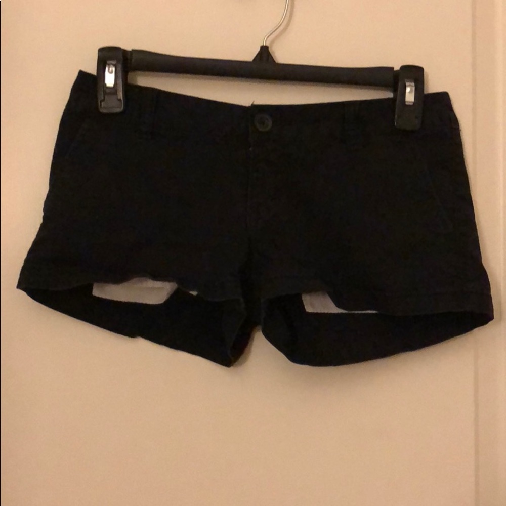 black shorts button up pockets on back
